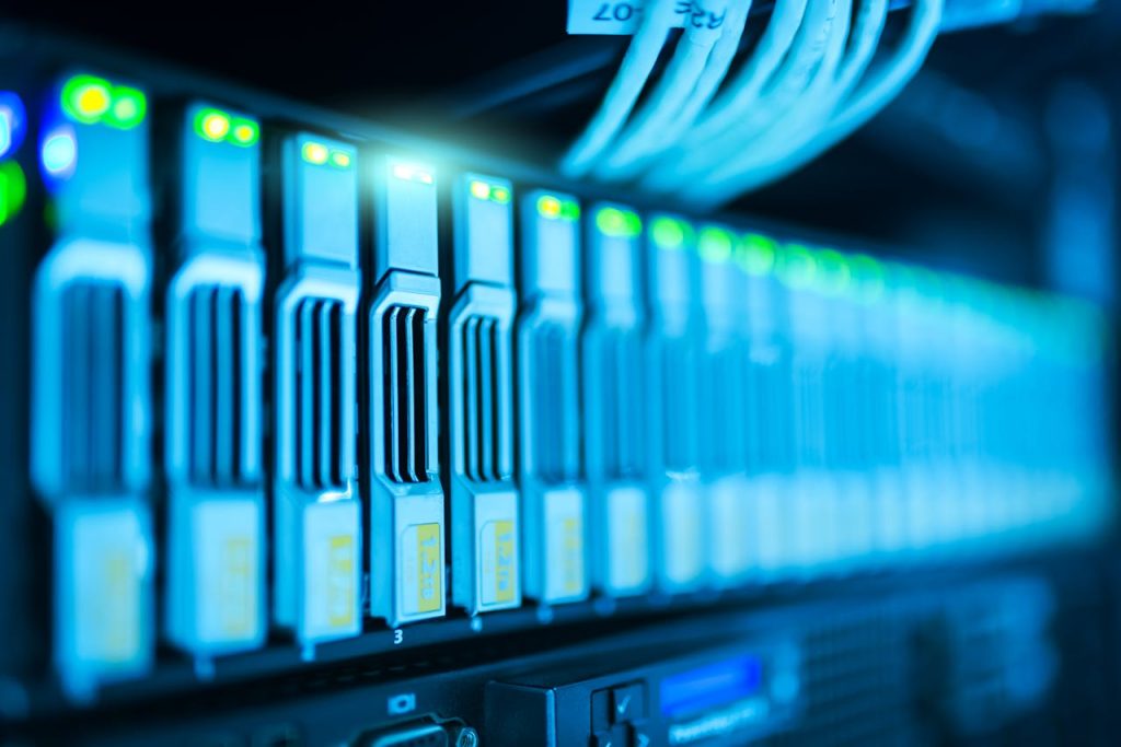 pexels-photo-1148820-1 Detailed image of a server rack with glowing lights in a modern data center.
